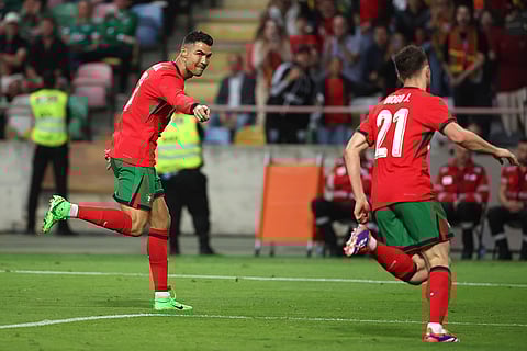 Cristiano Ronaldo celebrates after scoring a goal against Ireland